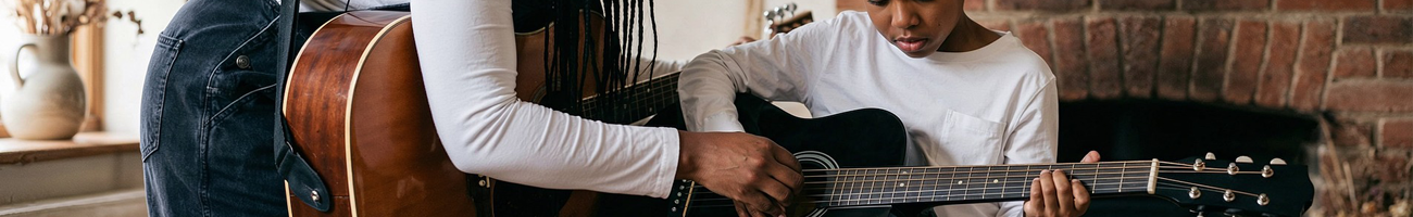 mom teaching son to play guitar